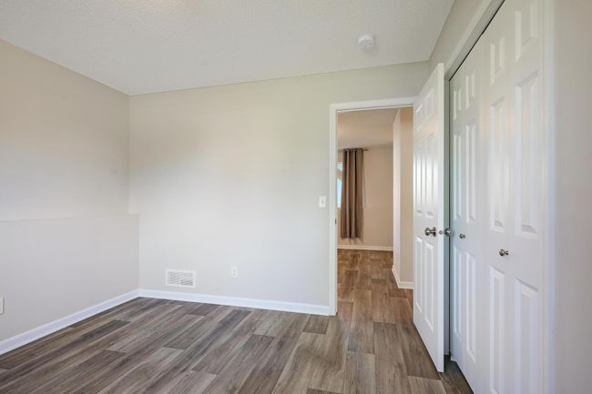 The lower level includes a fourth bedroom, perfect for guests or flexible use as a hobby or workout room. | Image 29