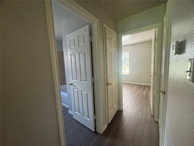 Hall way with 2 closets | Image 8