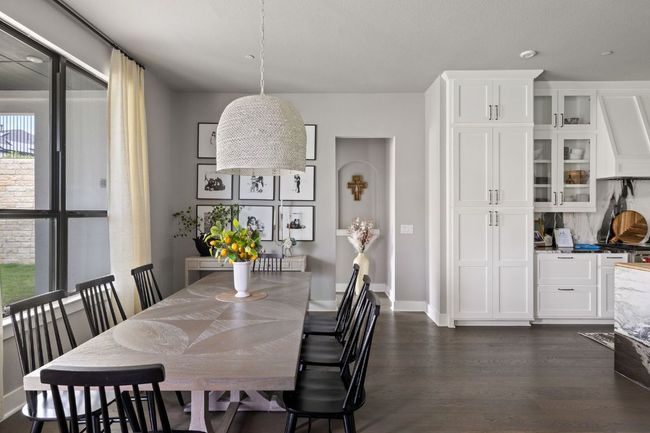 Dining room featuring dark wood-style flooring and baseboards | Image 13