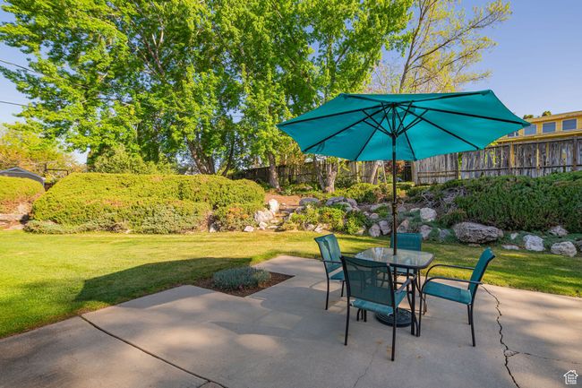 View of patio / terrace with fence and outdoor dining space | Image 6