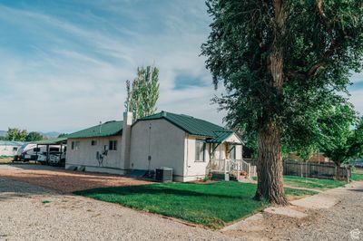 View of property exterior with a lawn | Image 3