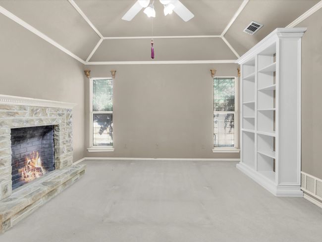 Large primary bedroom with long windows and tall ceilings that make the room feel oversized. | Image 24