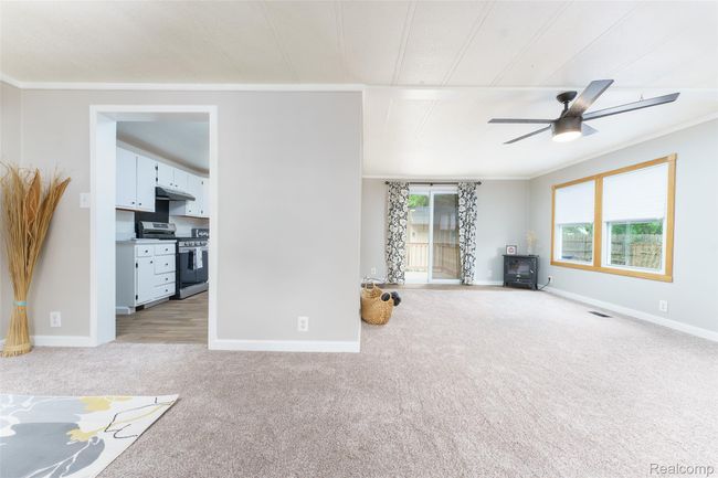 View into the large, bright living room | Image 5