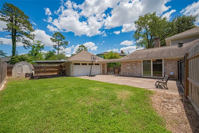 Shed, covered workshop or play area, large fenced area in the backyard. | Image 42