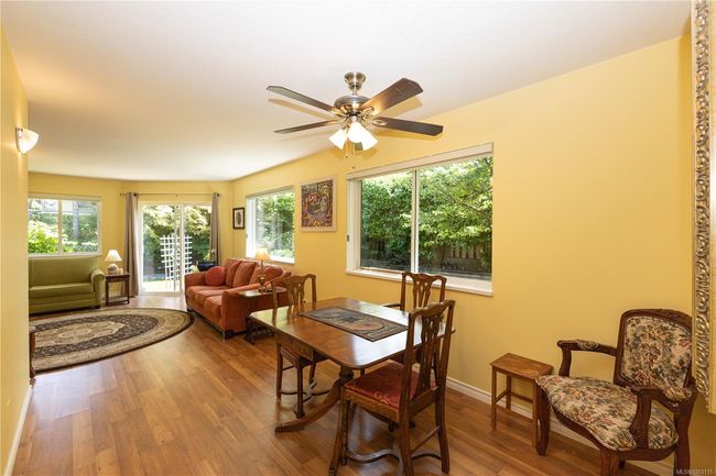 Kitchen flows through the dining room into the living room. Extra windows because this is an end unit | Image 16