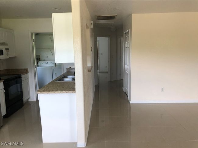 5615 Birdsong Ln, Home with 4 bedrooms, 2 bathrooms and null parking in BOKEELIA FL | Image 9