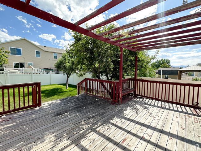 Deck featuring a pergola and a yard | Image 22