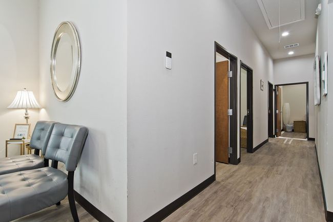 Hall featuring attic access, wood finished floors, and recessed lighting | Image 12