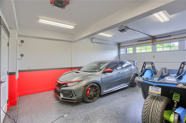This finished lower level has a walk out patio, tray ceiling, a 10x7 storage closet with plumbing for another full bath. Access to the garage is in this space. Furniture still has tags on it if there's interest in it! | Image 46