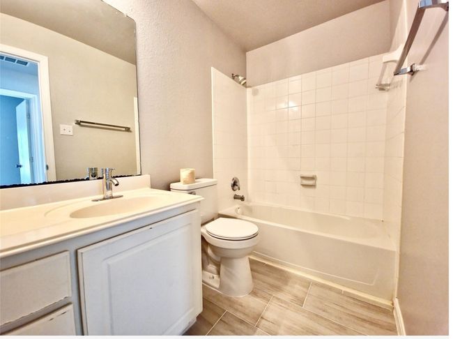 Full bath featuring vanity and tub / shower combination | Image 21