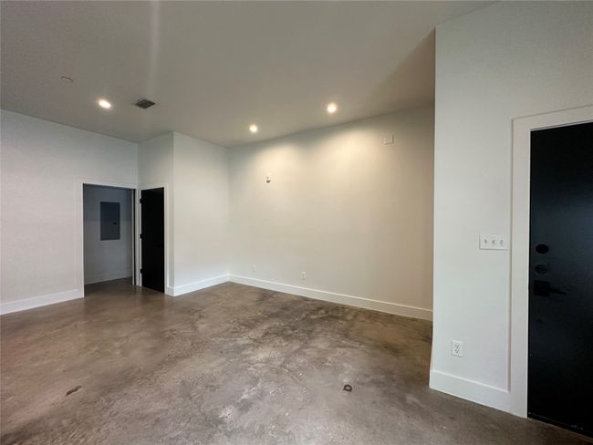 Spare room with finished concrete flooring and recessed lighting | Image 23
