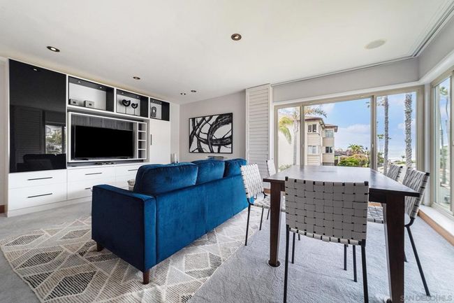 Living room showing beautiful custom built-in consul. | Image 7