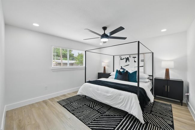 Bedroom with light wood-style floors, recessed lighting, baseboards, and a ceiling fan | Image 20