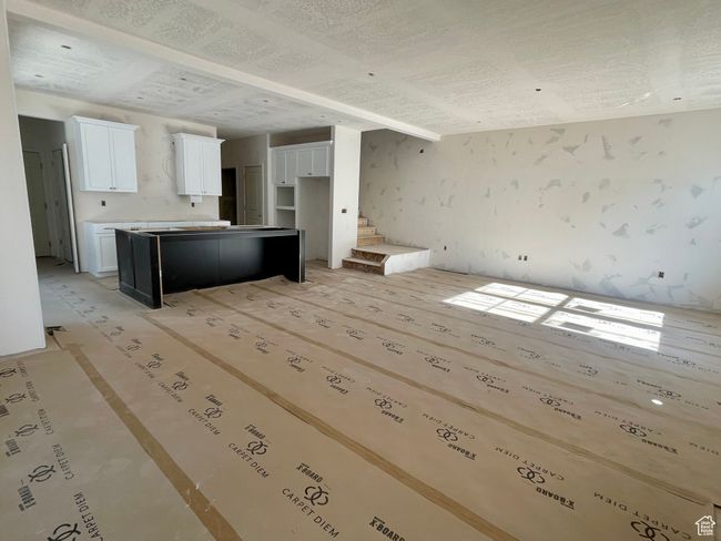 Unfurnished living room with stairway | Image 4