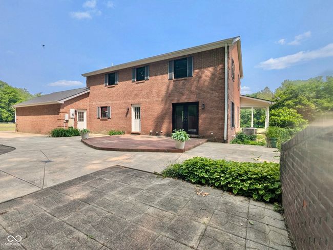 view of front of property featuring a patio, brick siding, and french doors | Image 8