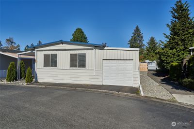 Front of home with rare one car garage. | Image 2