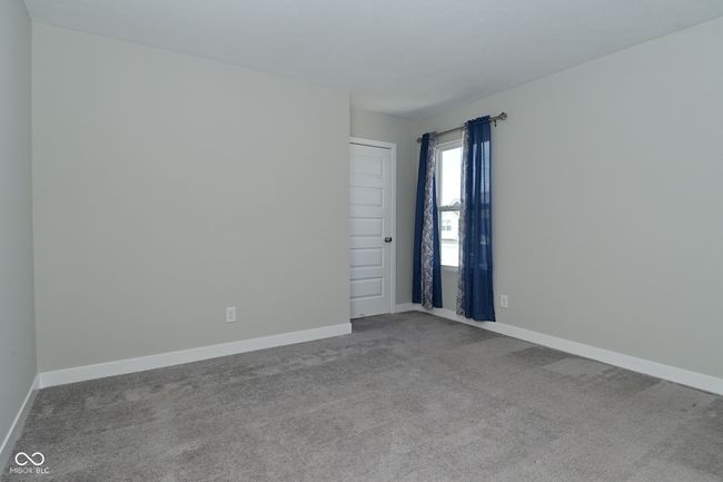 empty room with carpet flooring and baseboards | Image 30