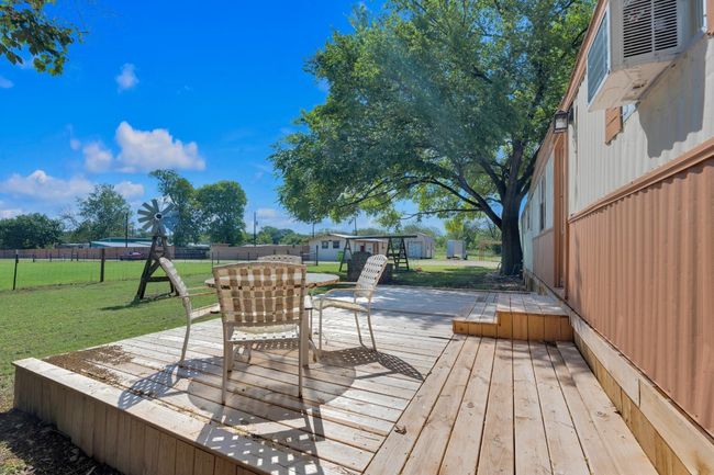Wooden deck with outdoor dining space | Image 36