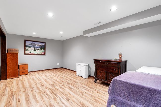 Family room featuring wood finished floors and recessed lighting | Image 22
