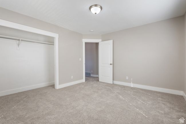 Unfurnished bedroom with carpet floors and a closet | Image 20