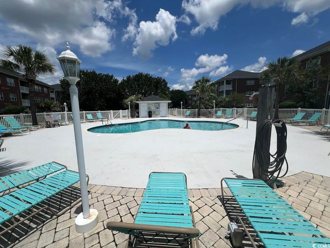 Community pool featuring a patio area | Image 12