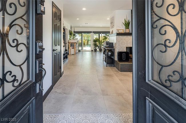 Entrance foyer with light tile patterned floors and recessed lighting | Image 5