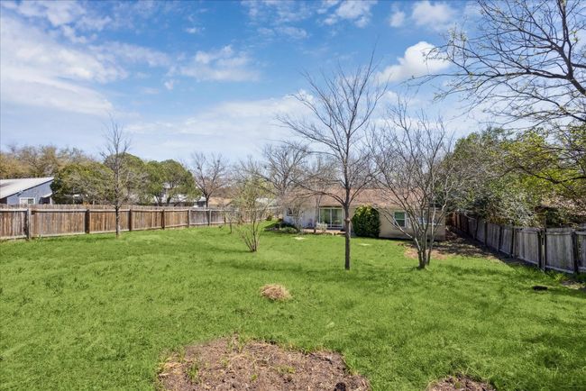 View of yard with a fenced backyard | Image 27