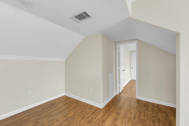 Bonus room featuring wood finished floors and vaulted ceiling | Image 30