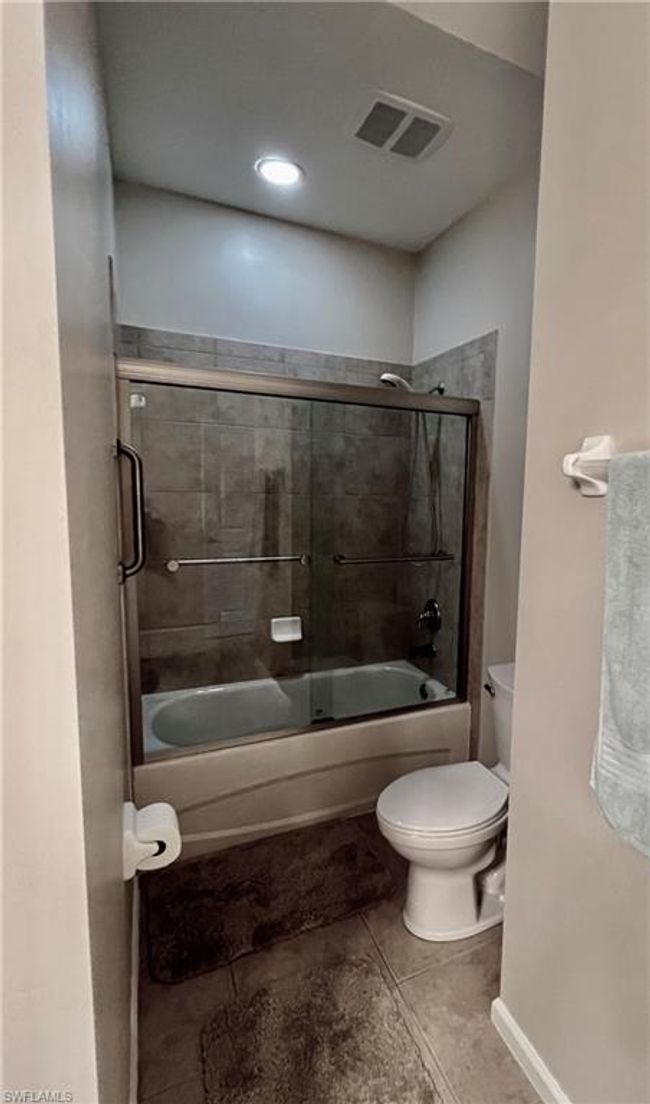 Tiled guest bath with nice shower and toilet | Image 27