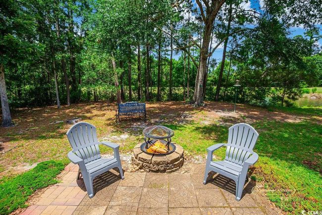 View of patio / terrace featuring an outdoor fire pit | Image 28