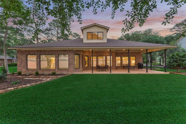 The back of the home was thoughtfully redesigned to include as many windows as possible, maximizing the stunning lake views. All doors and windows feature new energy-efficient seals, enhancing insulation and overall energy performance throughout the home. | Image 42