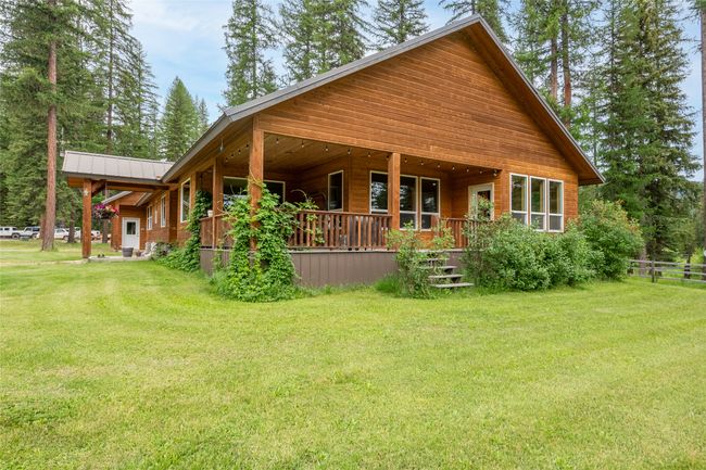 Back of property featuring a metal roof | Image 24