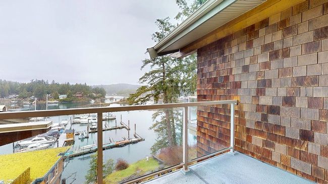 Balcony featuring a water view | Image 36
