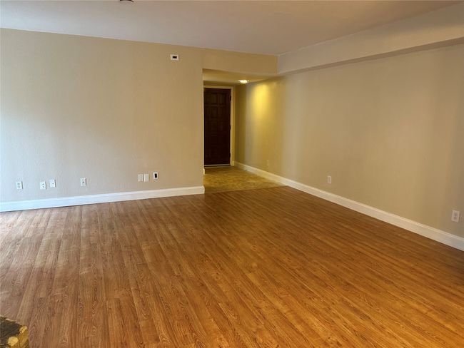Empty room featuring wood finished floors and baseboards | Image 10