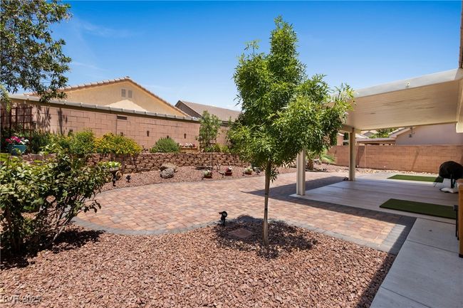 Fenced backyard featuring a patio area | Image 38