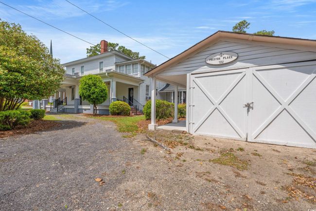 View of front of house featuring a porch and a chimney | Image 33