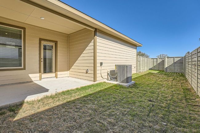 View of yard with a patio, cooling unit, and a fenced backyard | Image 26