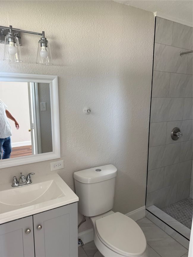 Full bath with a walk in shower and vanity | Image 11