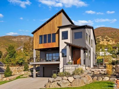 View of front of home featuring a garage and a mountain view | Image 1