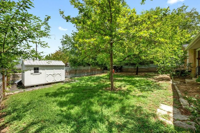 The backyard offers a storage shed. | Image 25