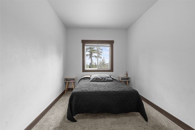 Carpeted bedroom featuring baseboards | Image 40