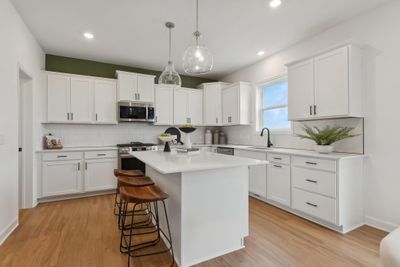 (*Photo of decorated model, actual homes colors and finishes will vary) Imagine preparing a wonderful meal for dinner in this kitchen or entertaining friends and family | Image 2