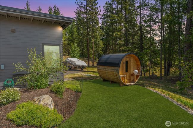 Tucked among the trees, a private sauna adds a luxurious touch—perfect for soothing soaks after a day of mountain adventures | Image 34