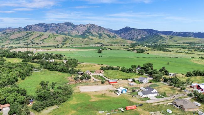 Aerial view of sparsely populated area featuring mountains | Image 79