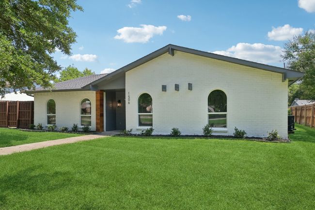 View of front of property featuring brick siding and roof with shingles | Image 4