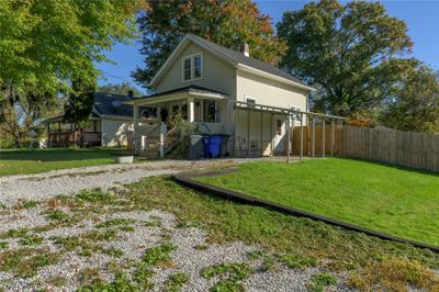 View of house with driveway and fence | Image 2