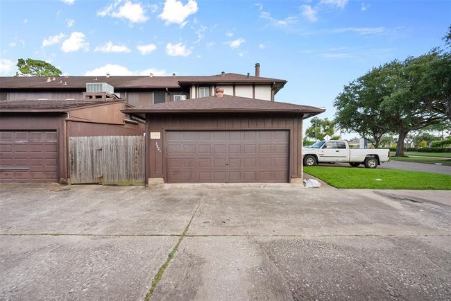 The attached, two-car garage--great for parking cars out of the summer heat! | Image 24