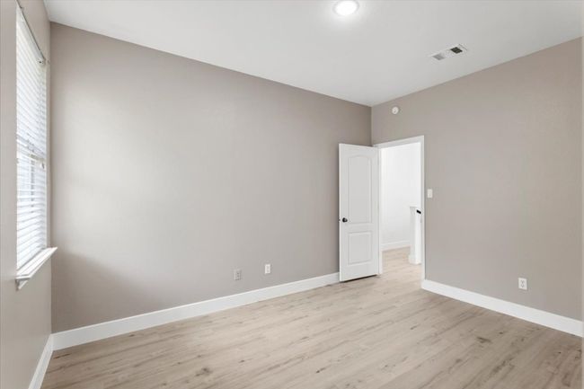 Empty room featuring light wood-style flooring and baseboards | Image 21