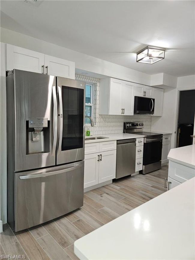 1322 Farmdale St, House other with 3 bedrooms, 2 bathrooms and null parking in LEHIGH ACRES FL | Image 4
