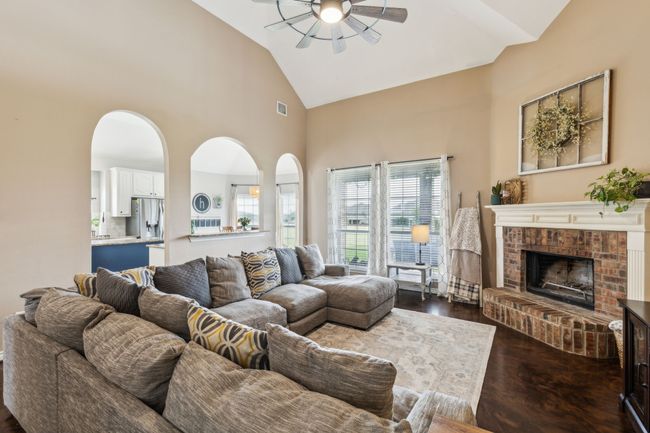 Living room featuring high vaulted ceiling, updated ceiling fan | Image 7